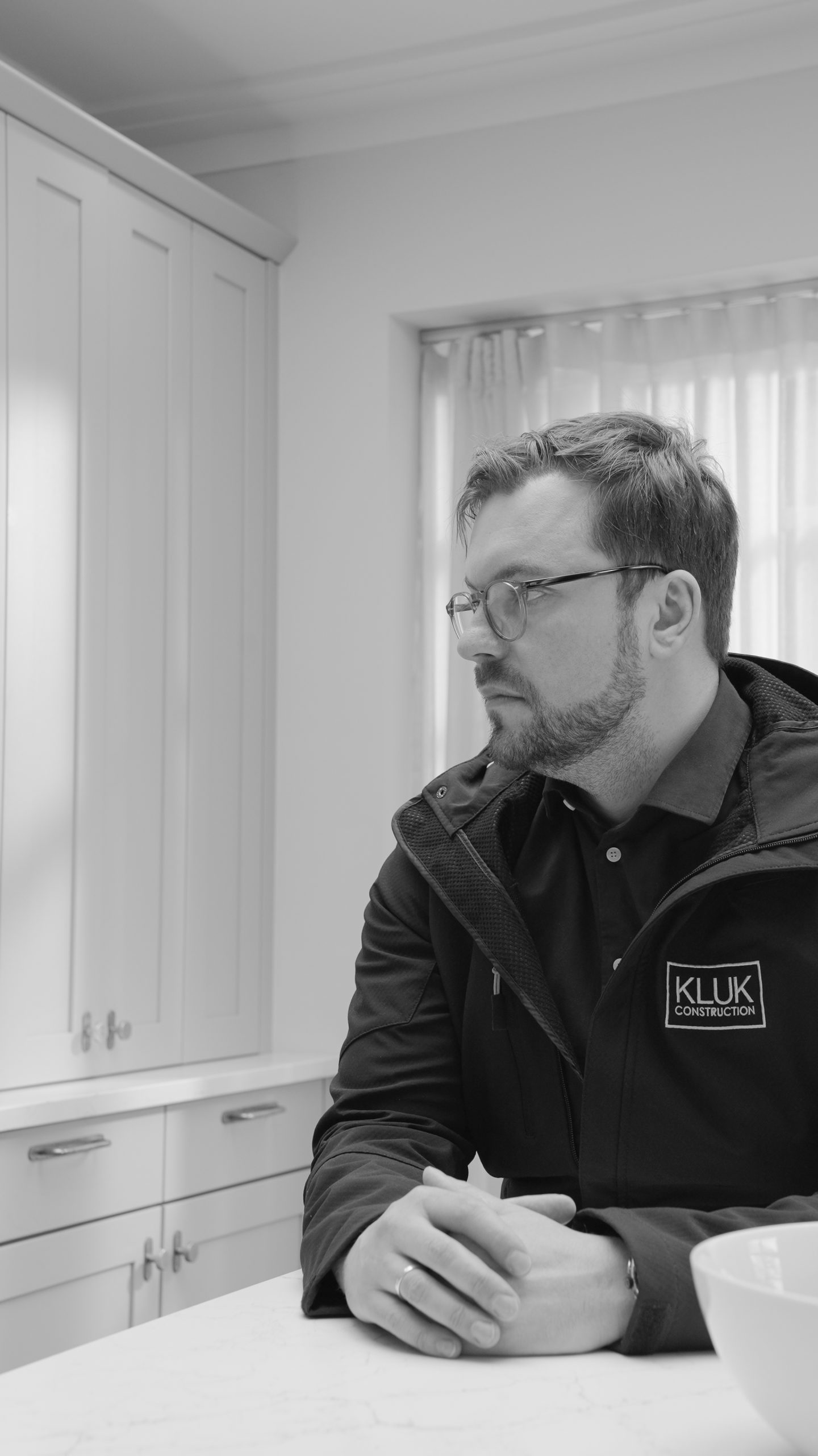 Marcin Kluk of Kluk Construction discussing a residential building project