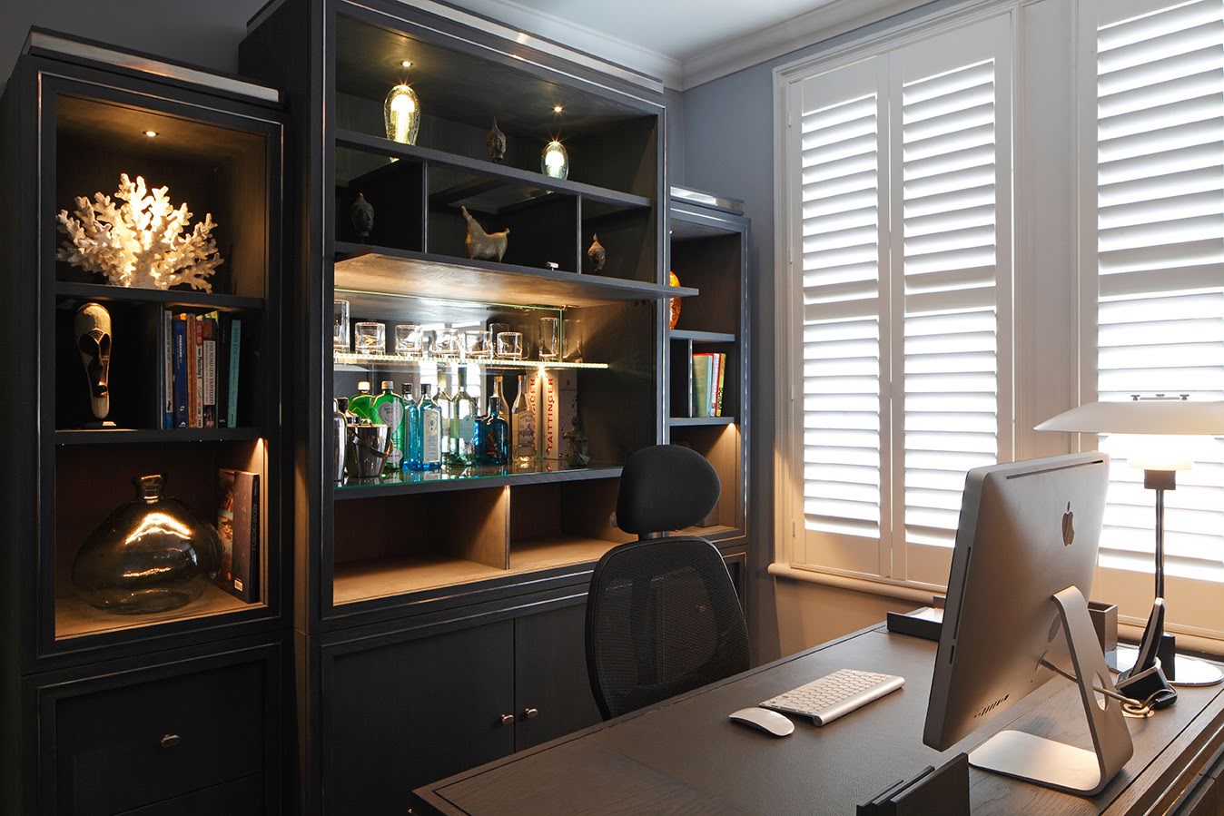 Bespoke home office with integrated bar, display shelving and fitted cabinetry