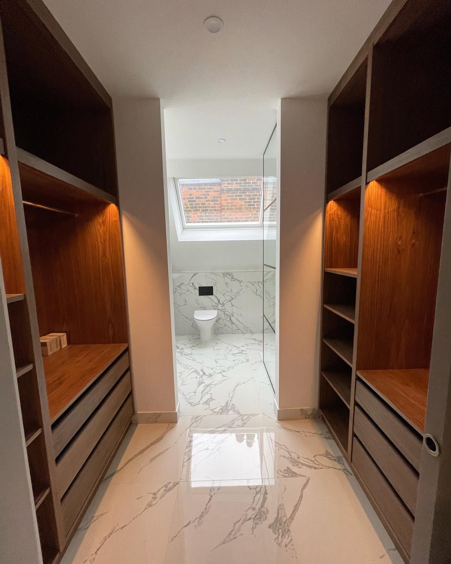 Made-to-measure walk-in wardrobe with fitted storage and oak cabinetry